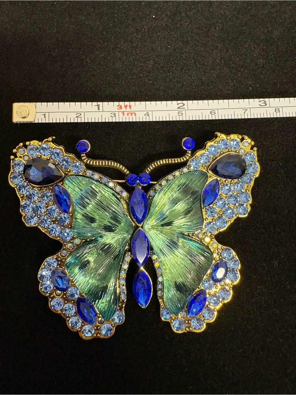 Large Blue, green, and goldtone butterfly brooch.